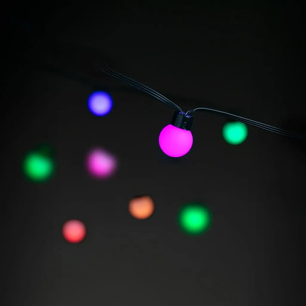 Lite Bulb Moments Smart Light Chain - Globe 3 cm, med livfulla flerfärgade LED-lampor, lämplig för evenemang både inomhus och utomhus.